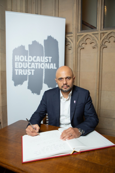 Sajid Javid MP signing the 2023 Holocaust Book of Commitment. 